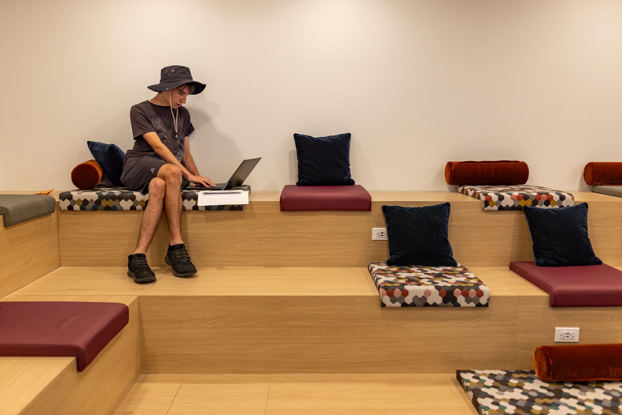 Photo of a student sitting in the First Resort's tiered seating